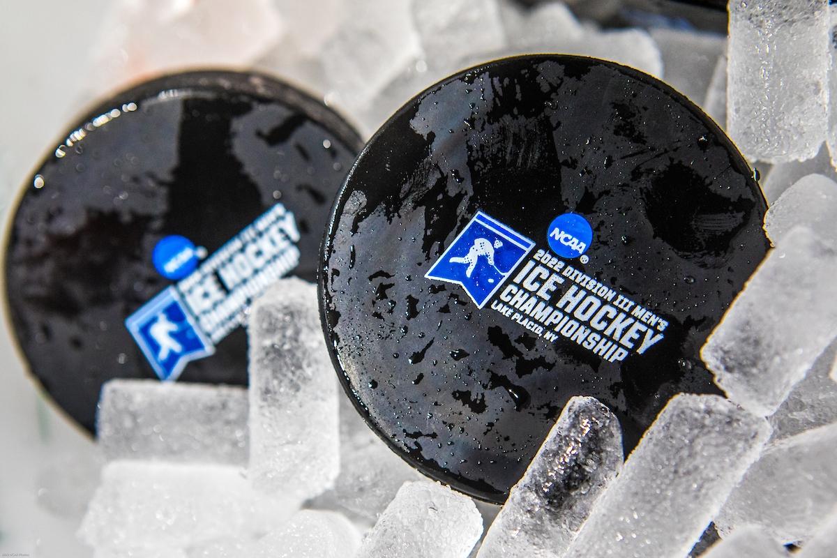 Pucks on ice during the Division III Men's Ice Hockey Championship