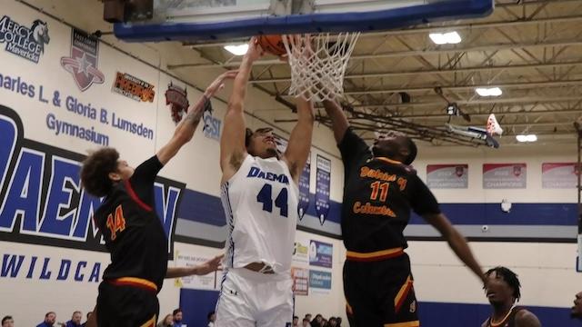 Benjamin Bill fights at the basket for undefeated Daemen. 