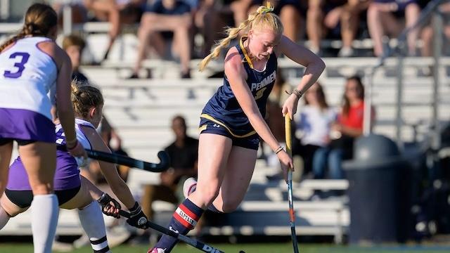 SNHU field hockey charges for a goal. 